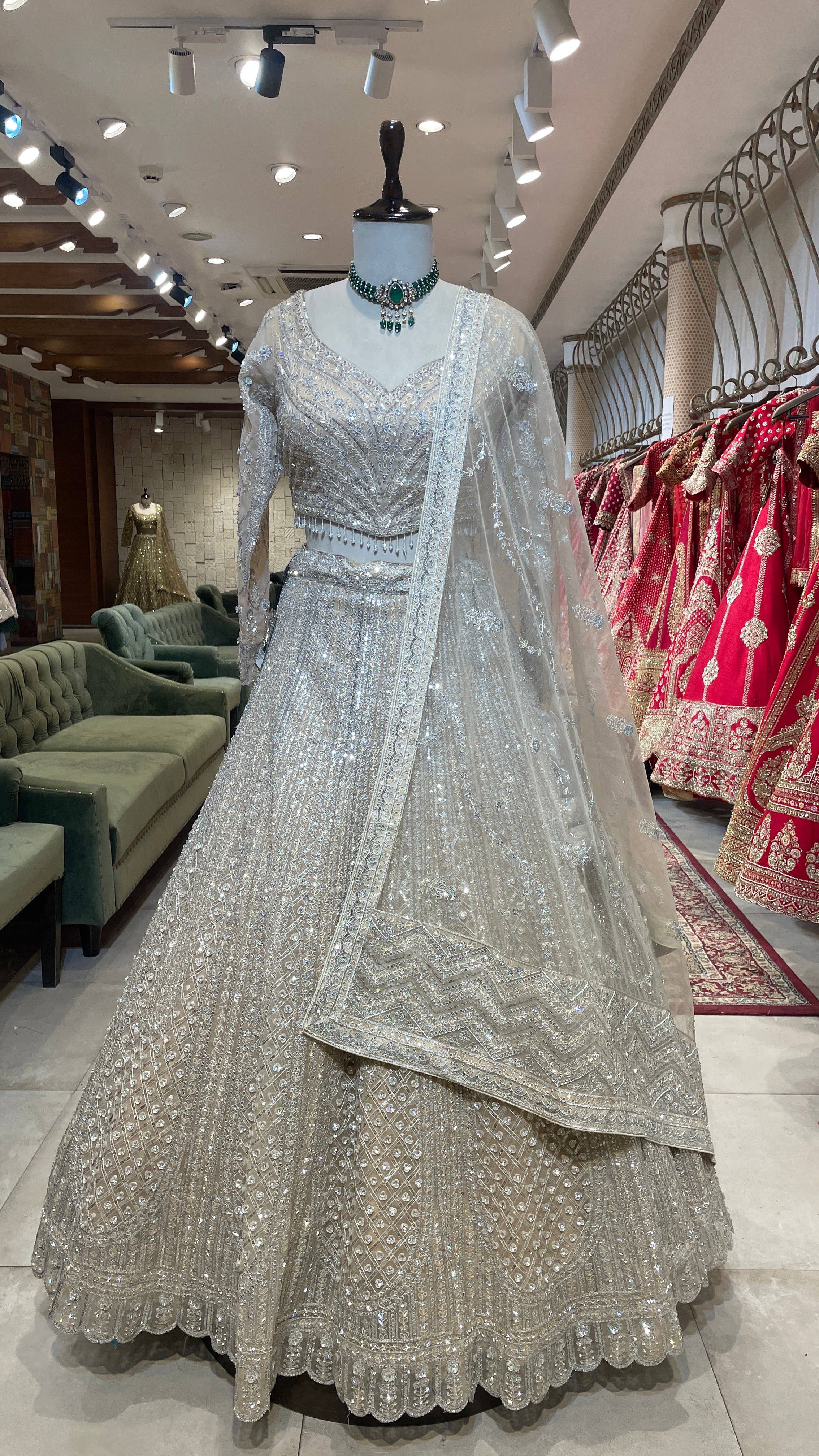 Cream net lehenga with sequins embellishments