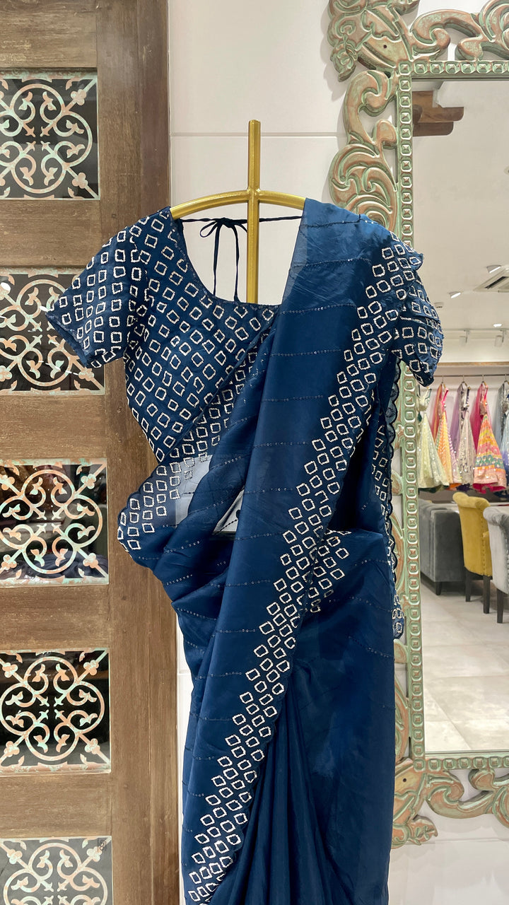 Blue organza saree with cutdana embellishments