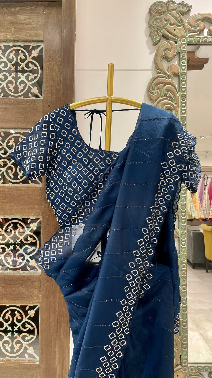 Blue organza saree with cutdana embellishments