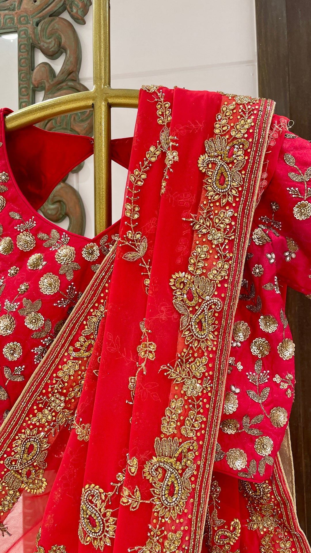 Red saree with gold embellishment