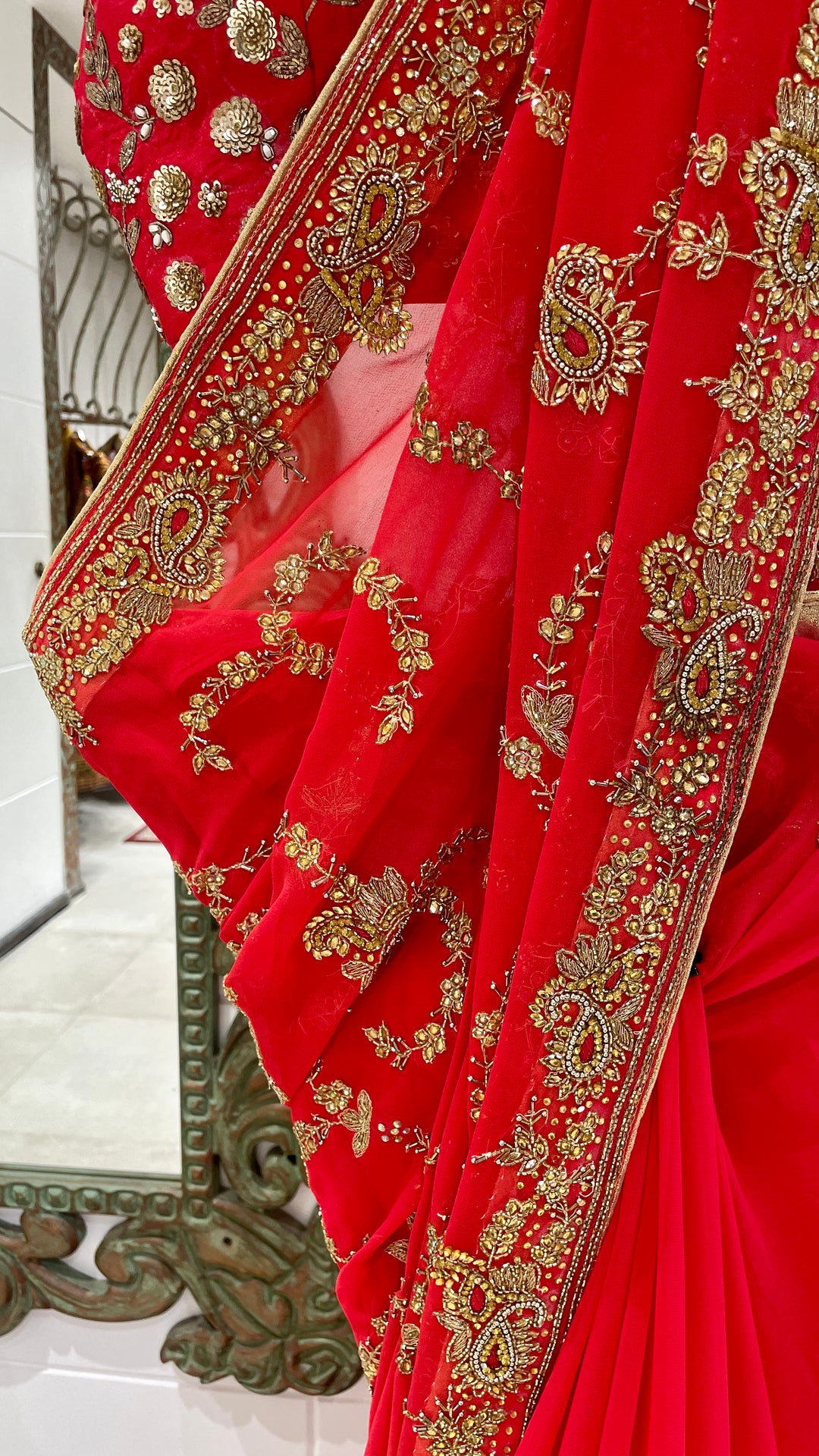 Red saree with gold embellishment