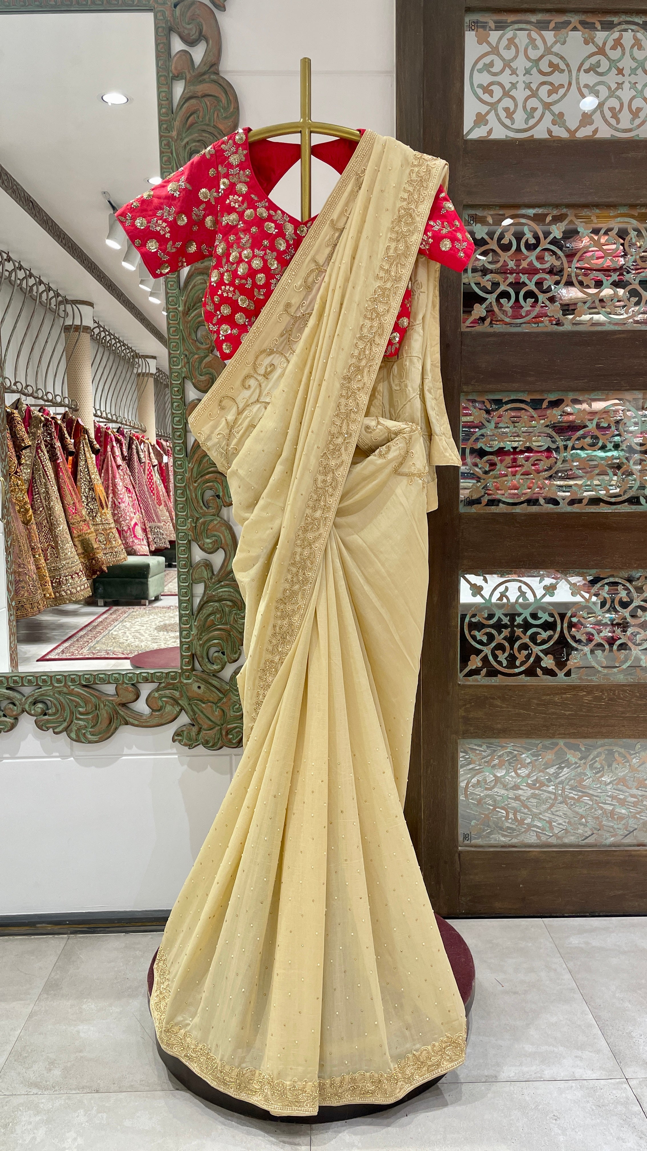 Cream crape saree with gold embellishment