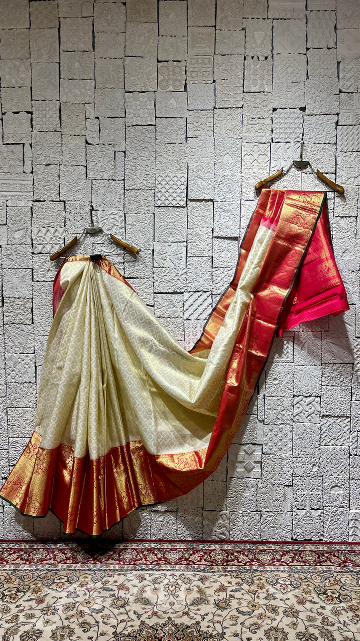 Cream silk kanjivaram saree with red border