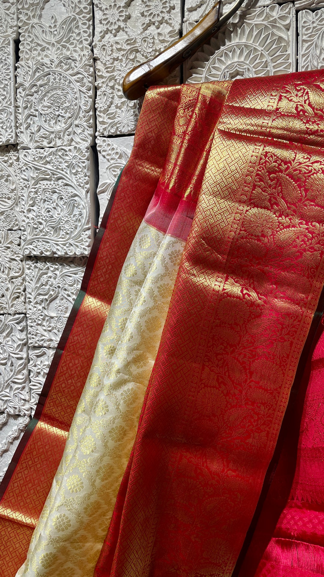 Cream silk kanjivaram saree with red border