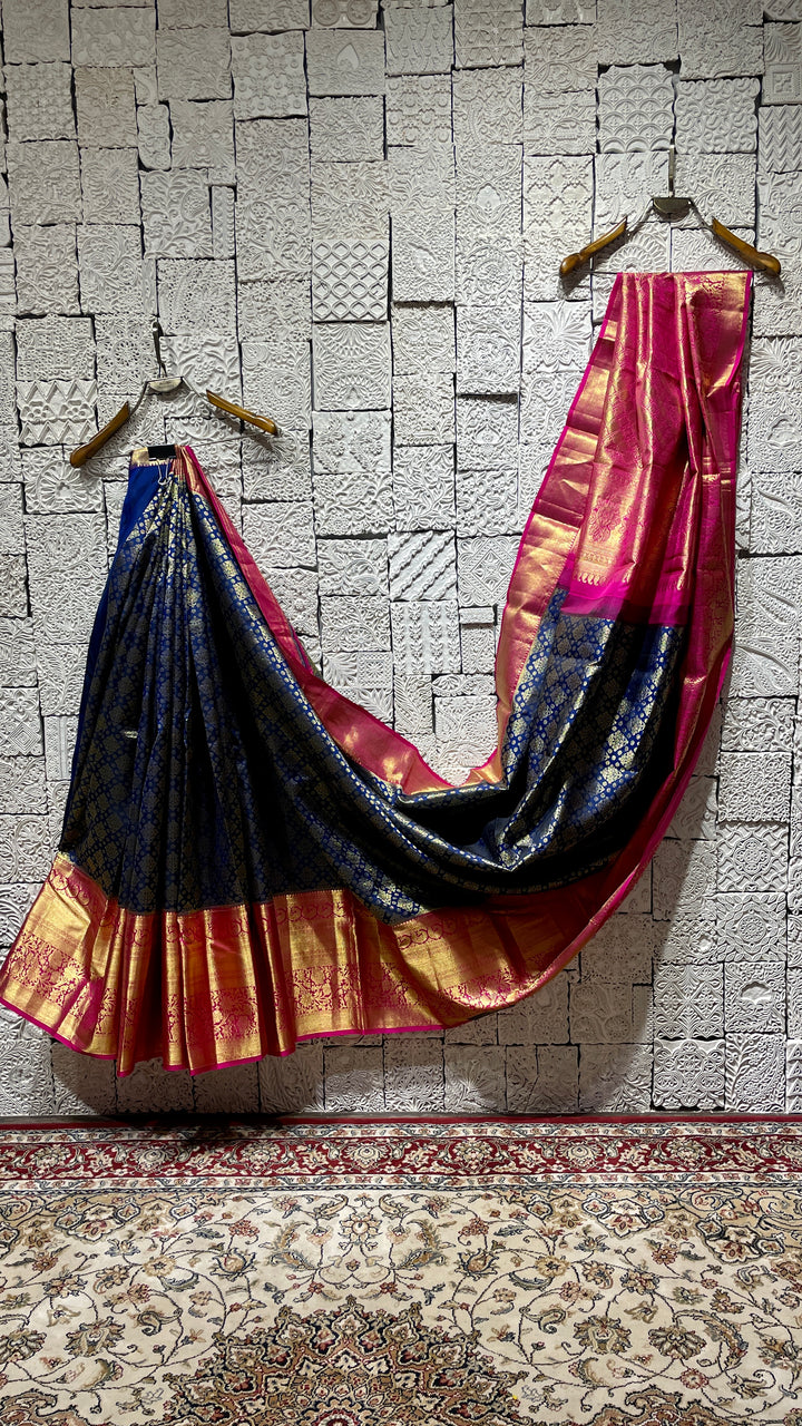 Blue silk kanjivaram saree with pink border