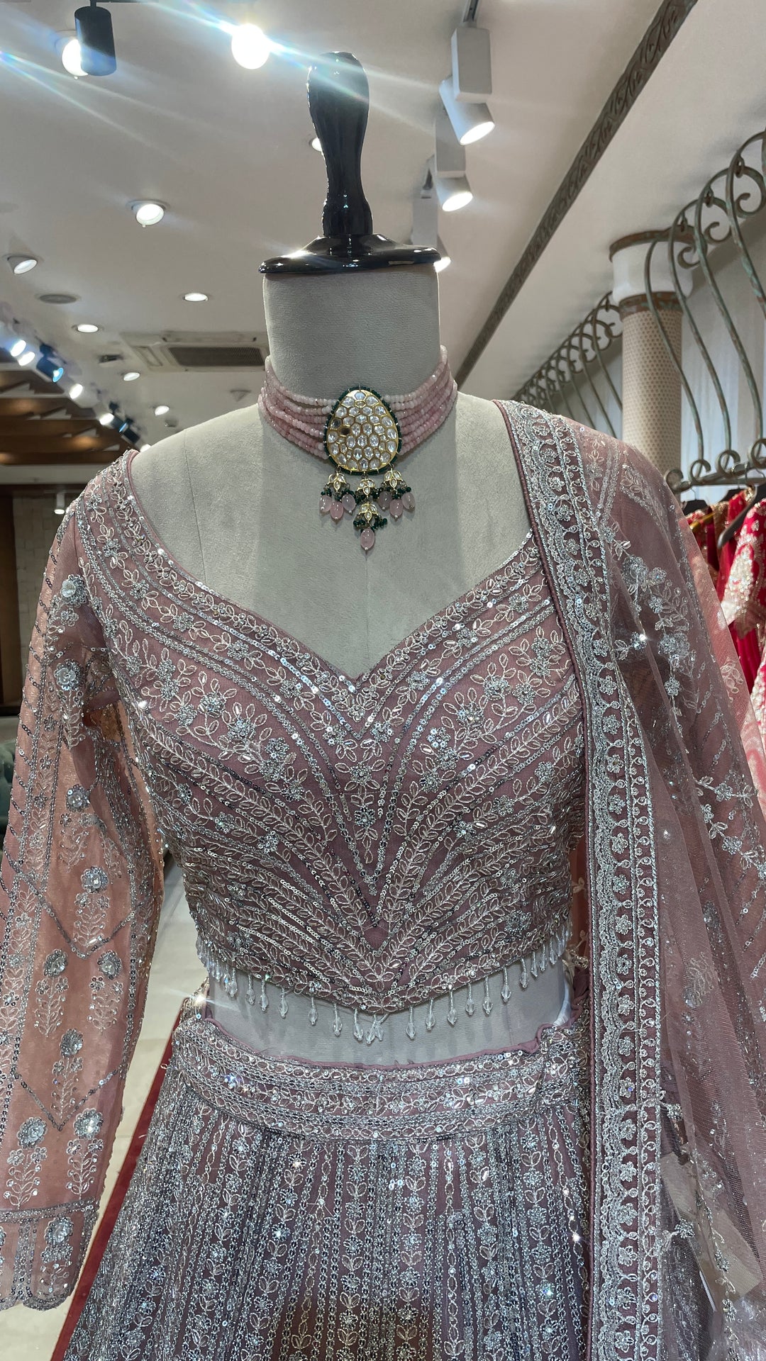 Peach net lehenga with sequins embellishments