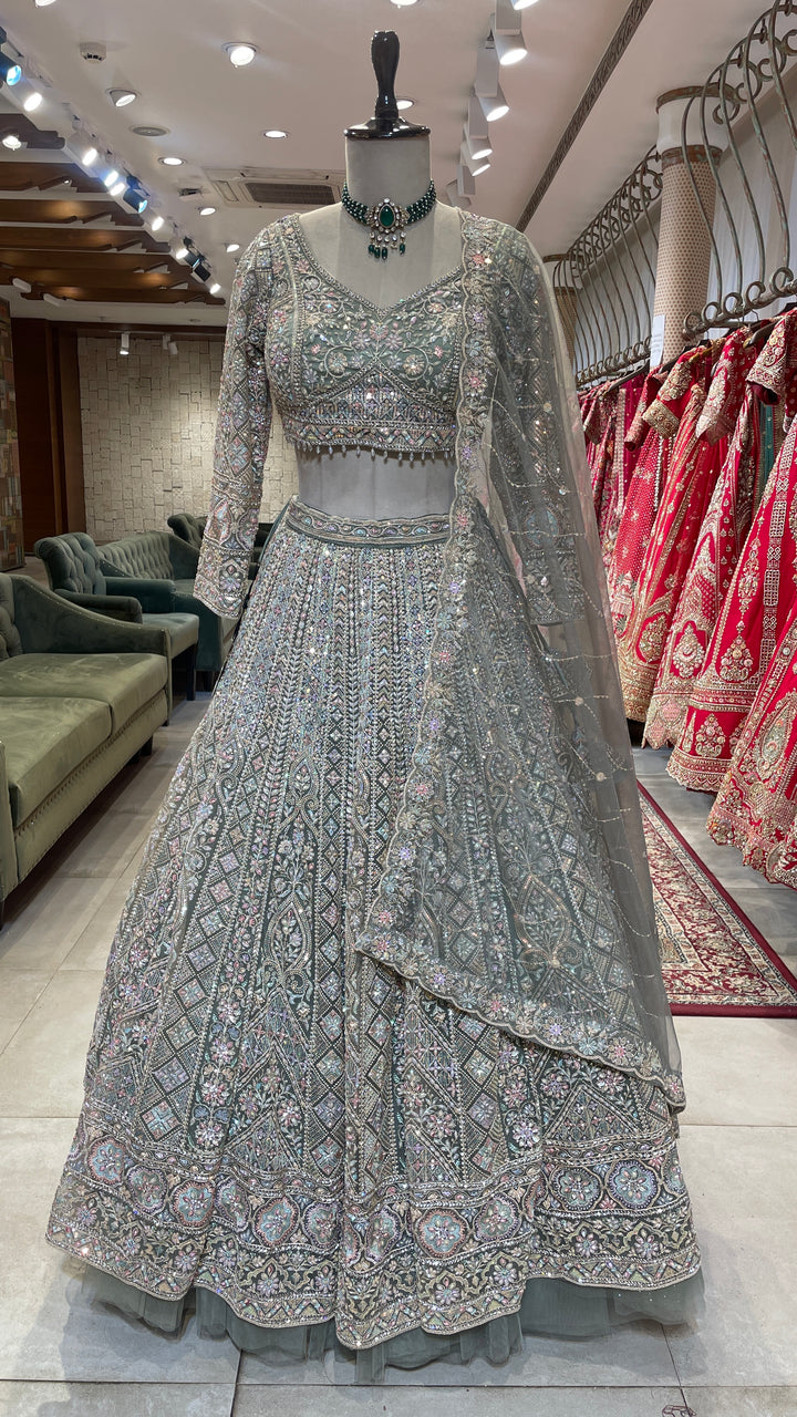 Pastel green net lehenga with Multicolour sequins embellishments