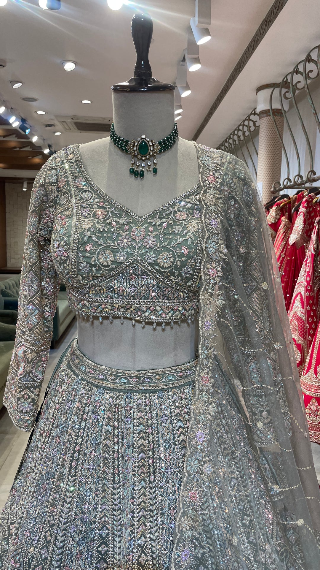 Pastel green net lehenga with Multicolour sequins embellishments