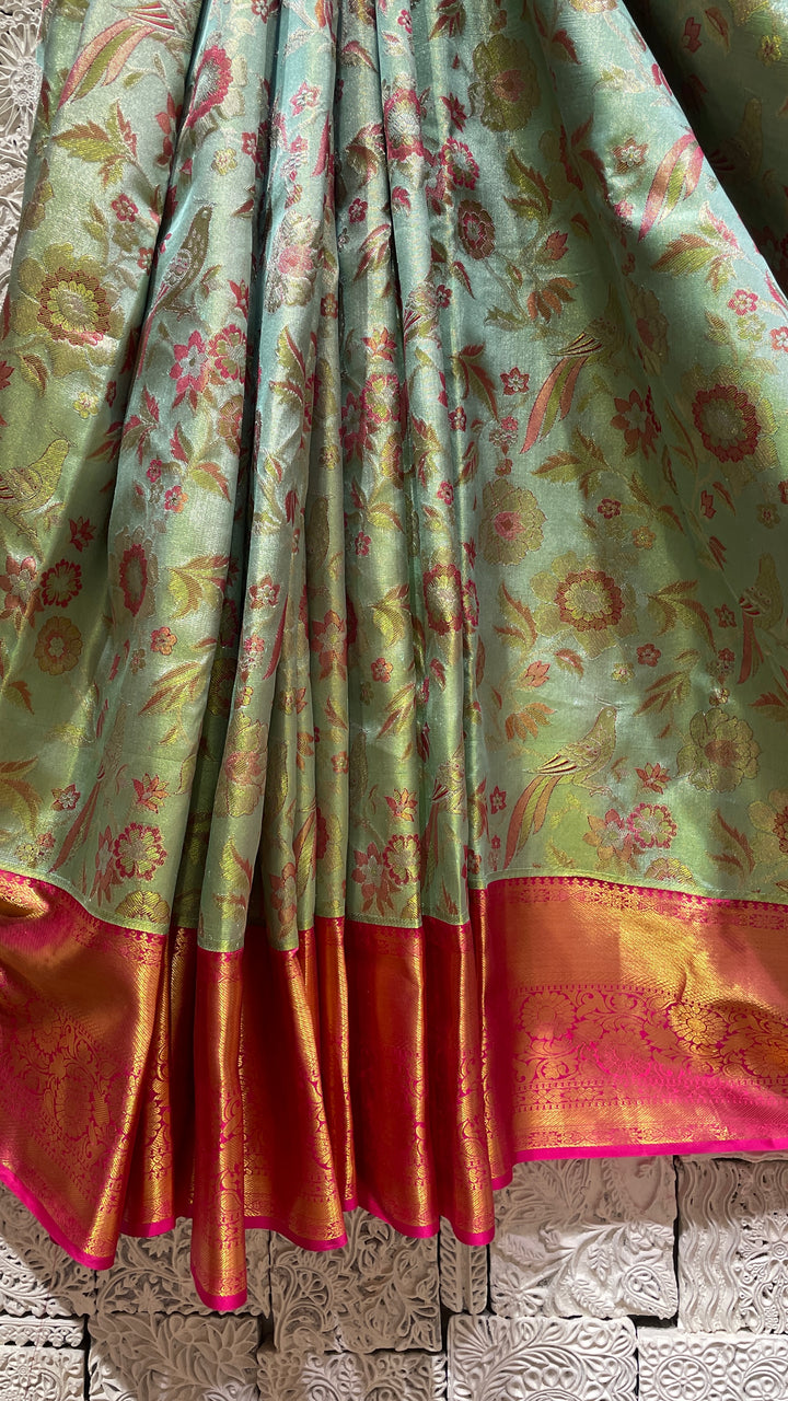 Green silk Kanjivaram saree with pink border