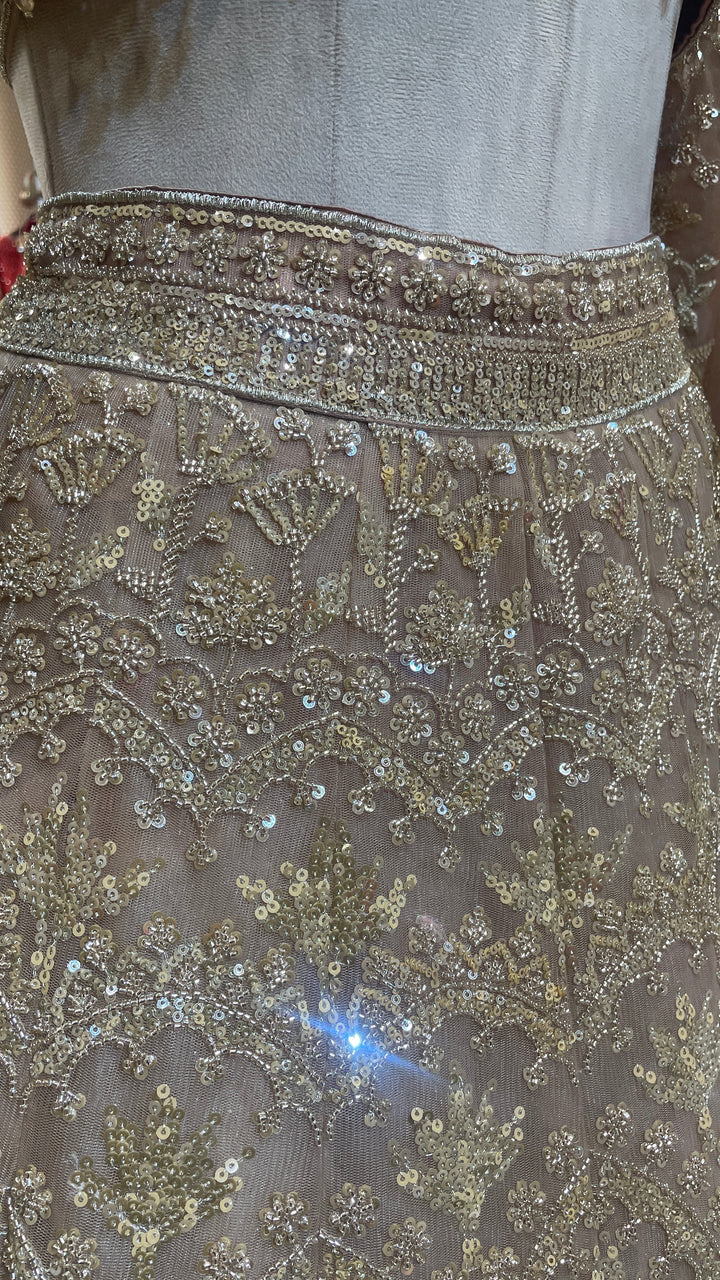 Peach net lehenga with sequins & bead embellishments