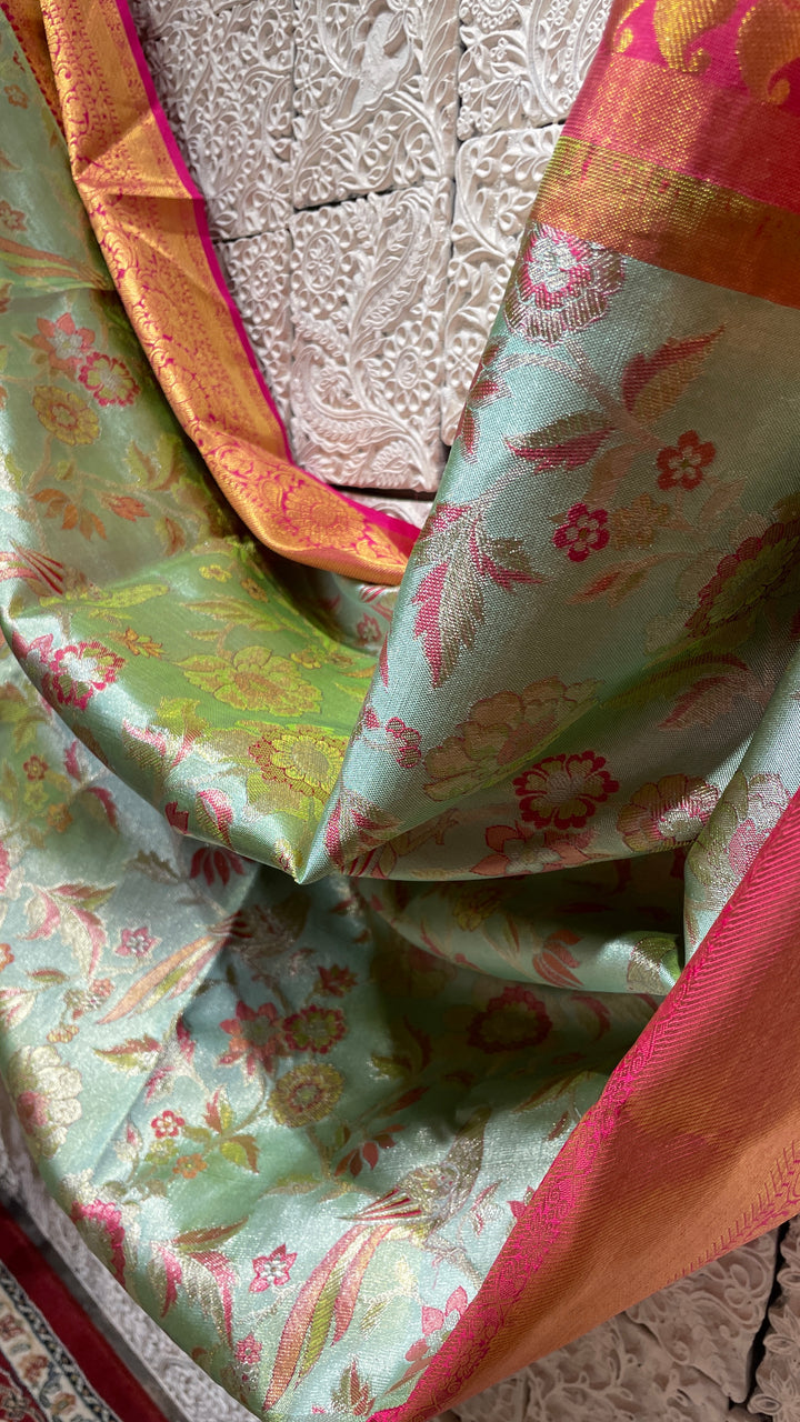 Green silk Kanjivaram saree with pink border