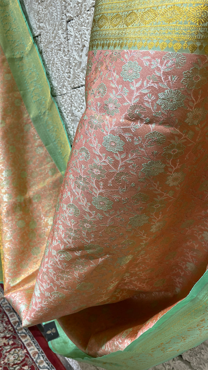 Pastel pink silk kanjivaram saree with green border