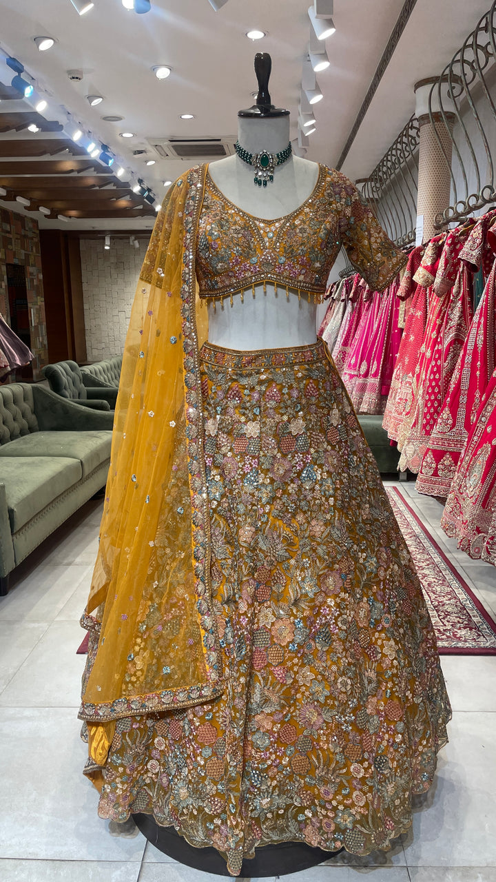 Mustard organza lehenga with floral motifs