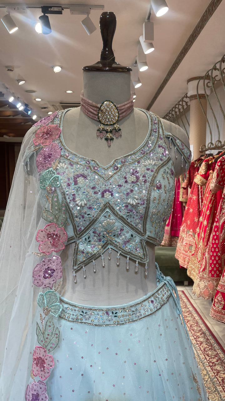 Pastel blue net lehenga with floral motifs