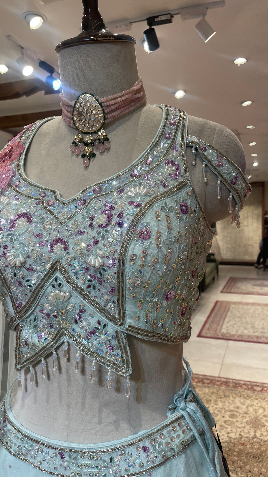 Pastel blue net lehenga with floral motifs