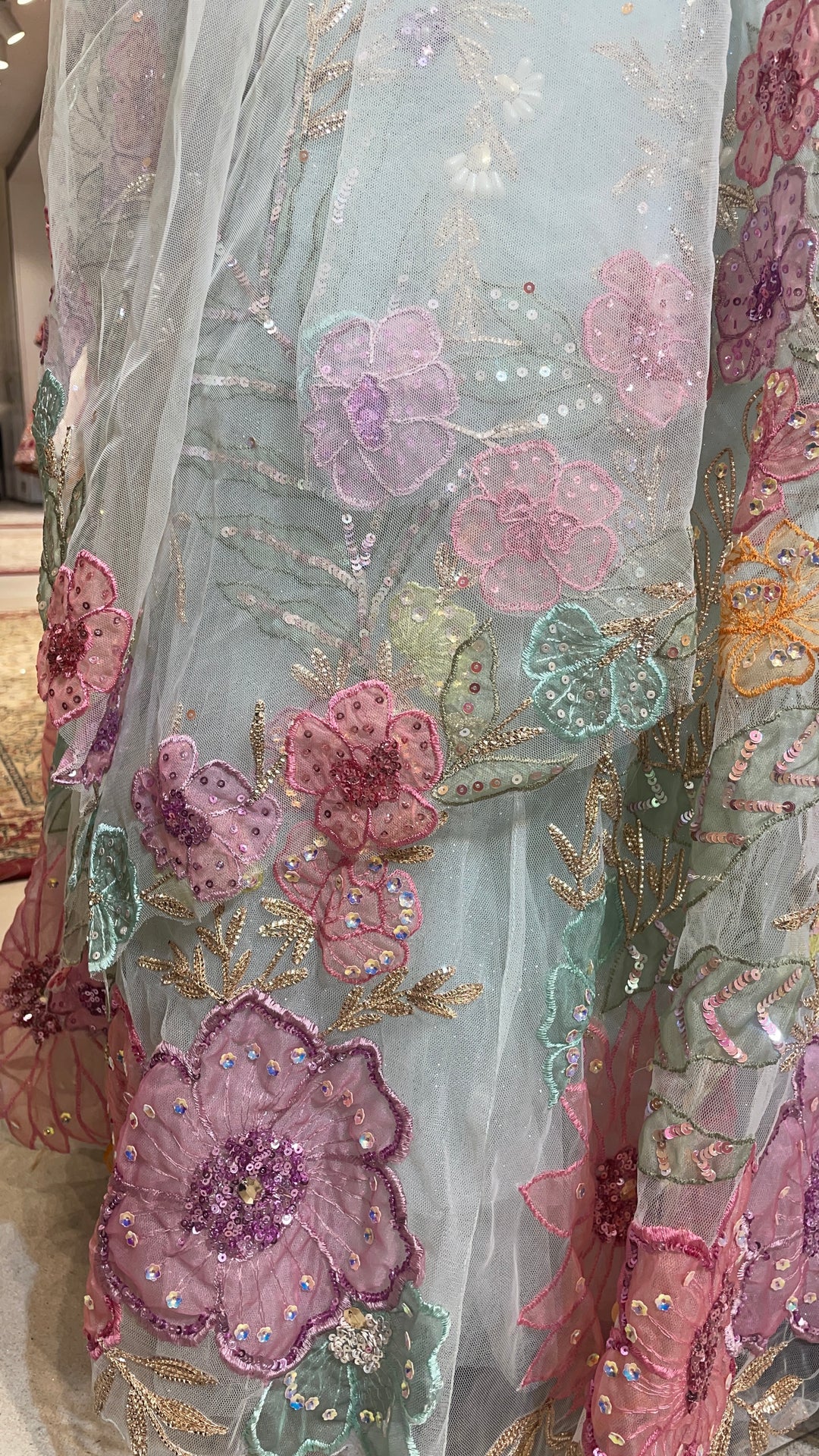 Pastel blue net lehenga with floral motifs