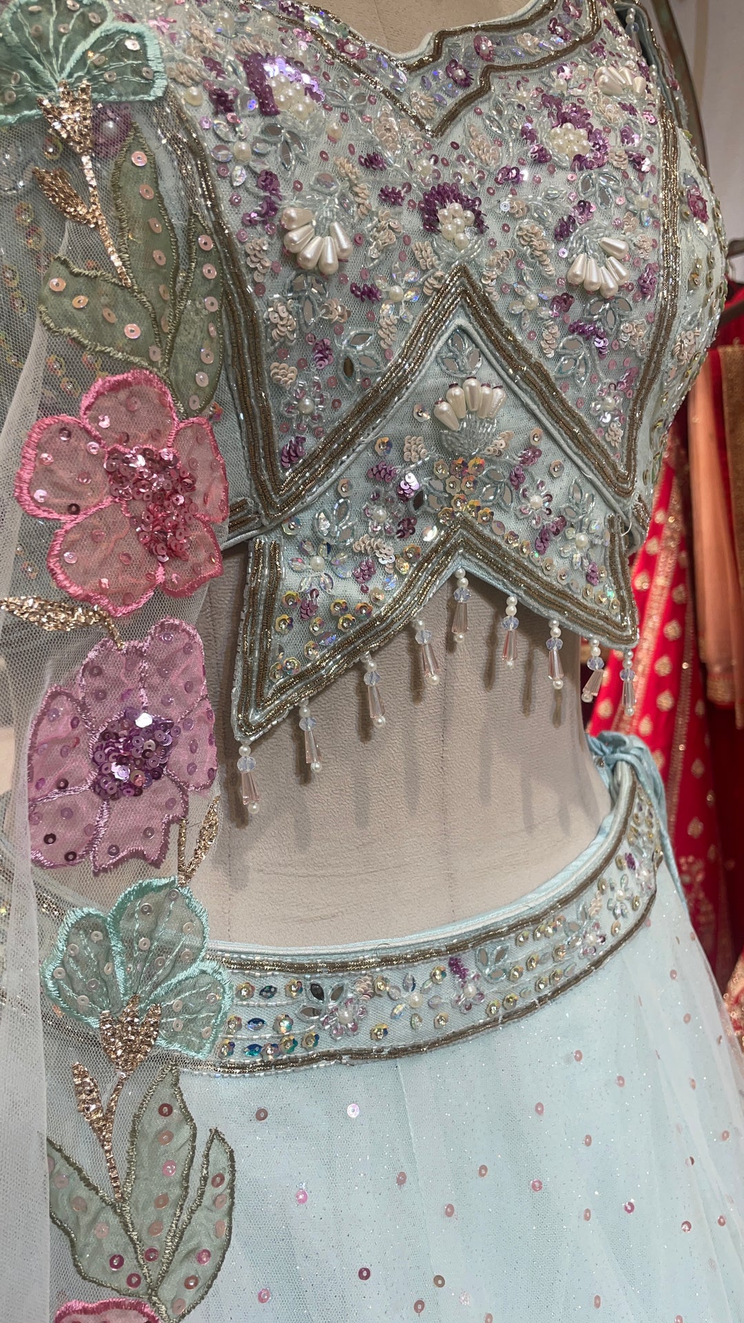 Pastel blue net lehenga with floral motifs