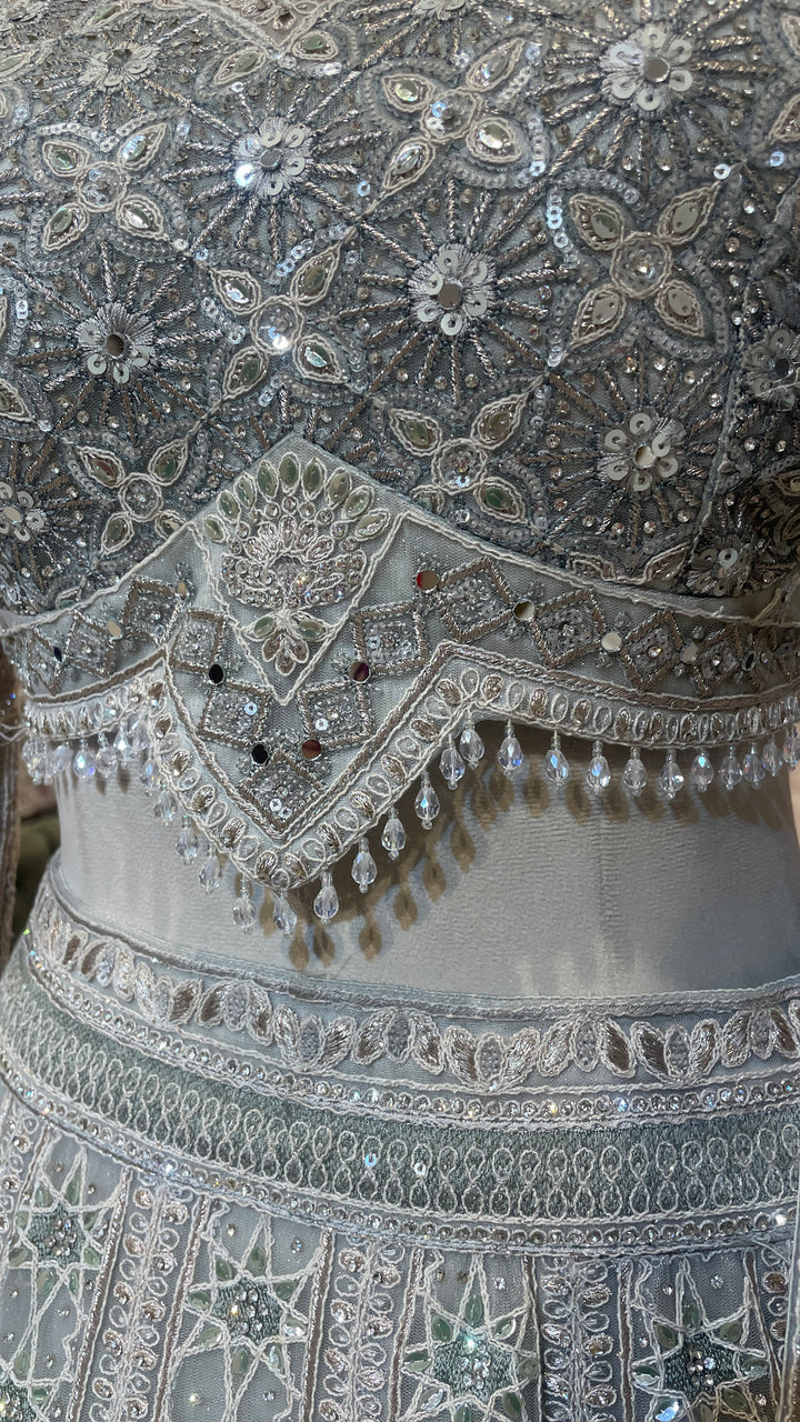 Grey net lehenga with sequin embellishments