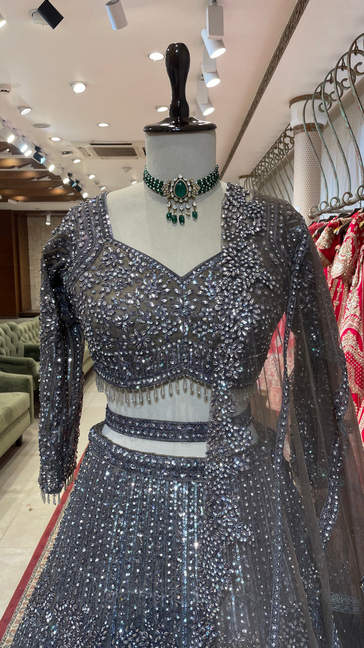 Silver net lehenga with sequins and bead embellishments