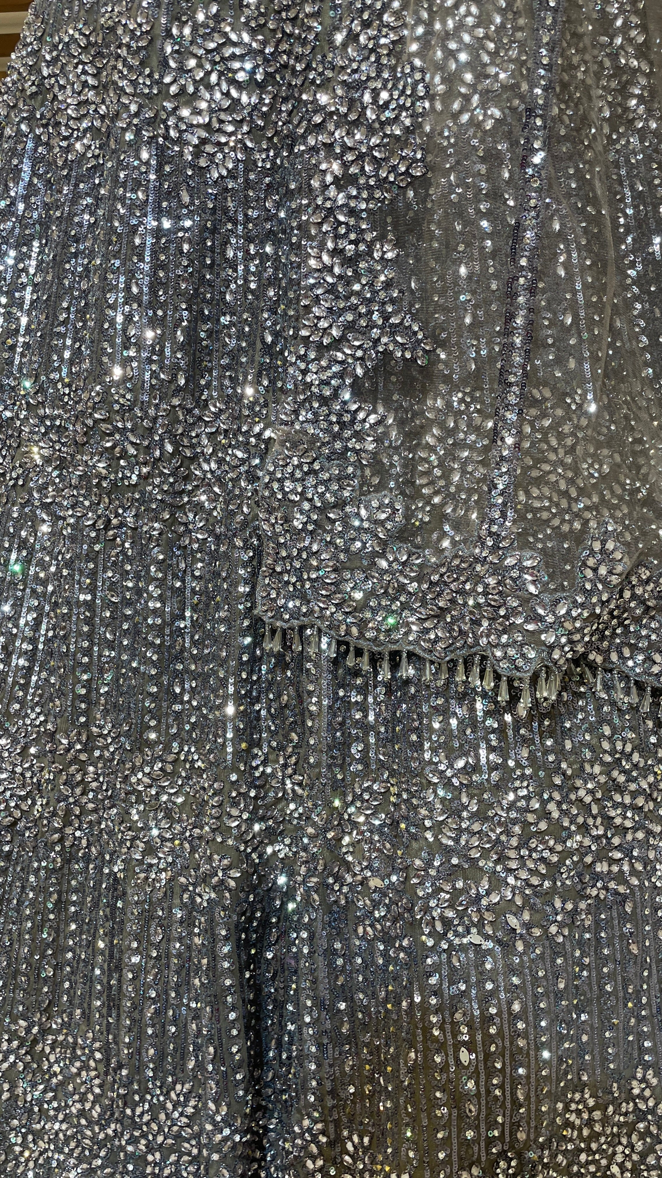 Silver net lehenga with sequins and bead embellishments