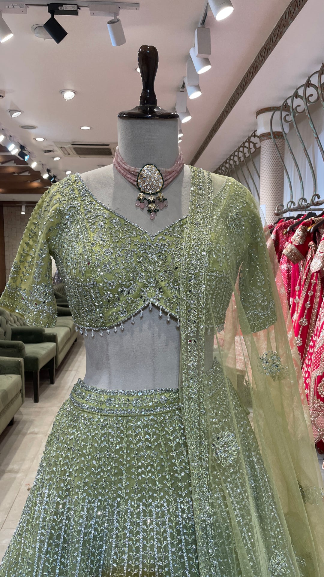 Pastel green net lehenga with silver embellishments