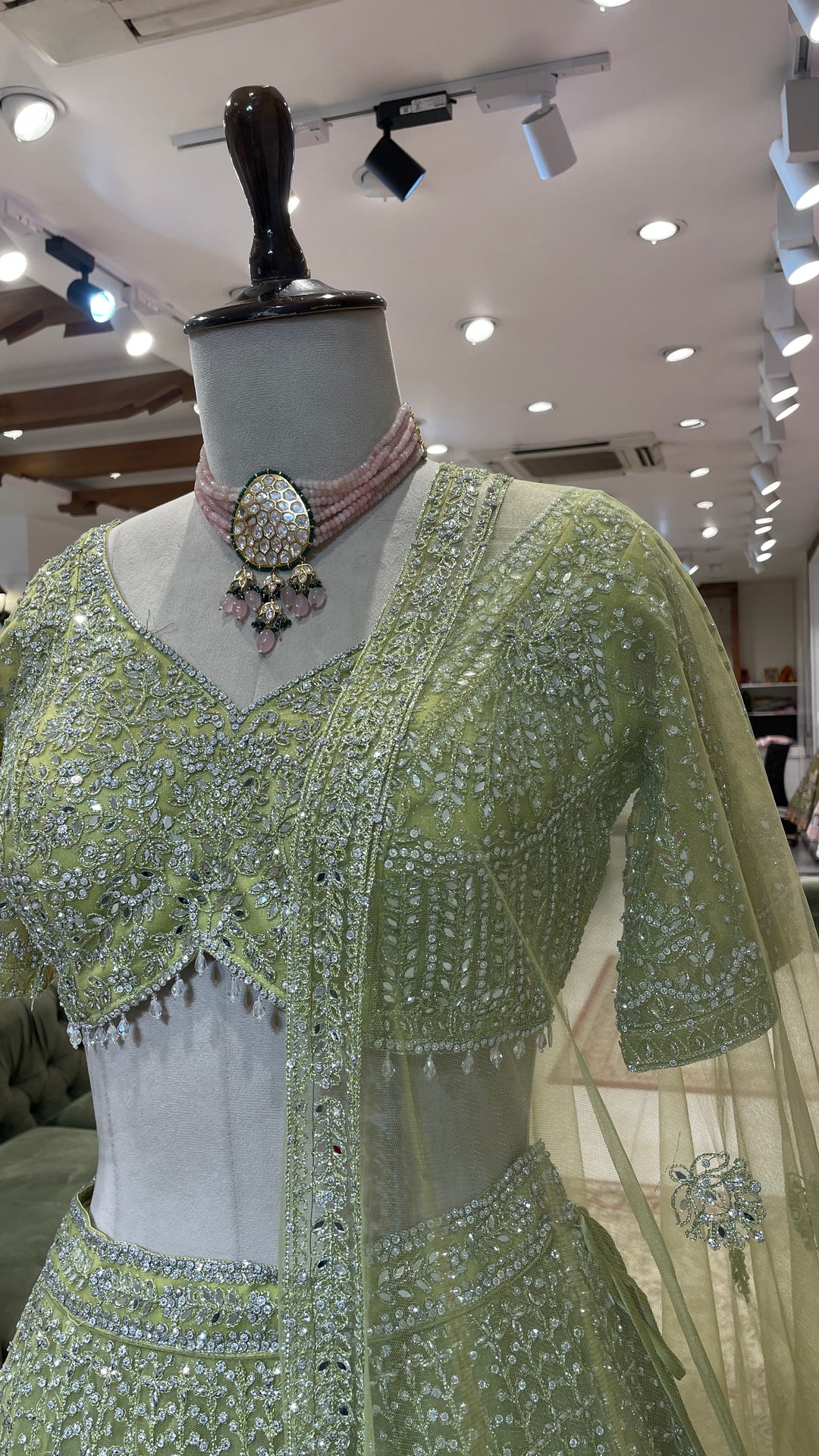 Pastel green net lehenga with silver embellishments