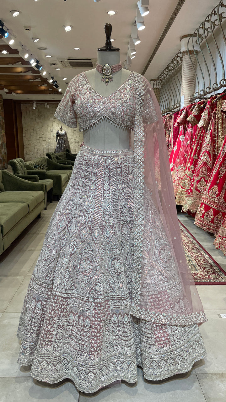 Pastel pink net lehenga with sequins and threadwork