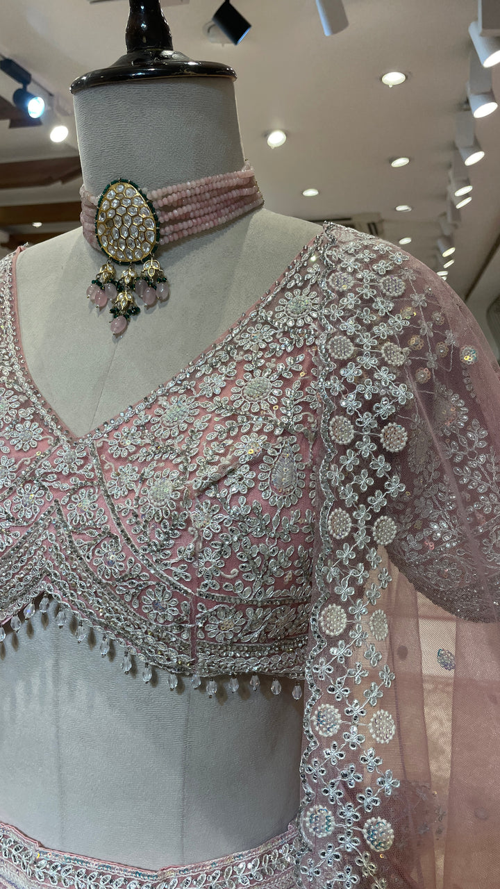 Pastel pink net lehenga with sequins and threadwork