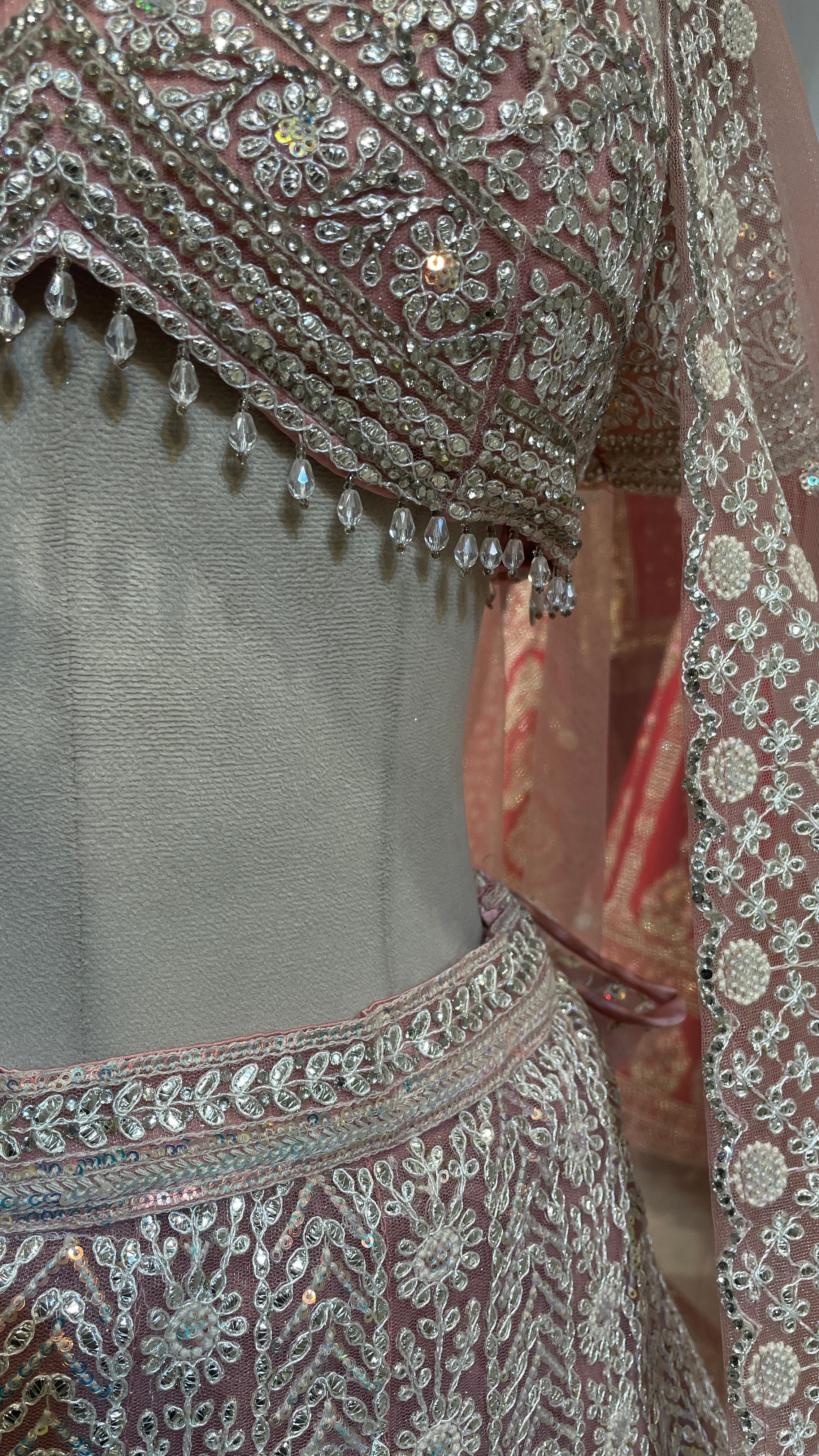 Pastel pink net lehenga with sequins and threadwork