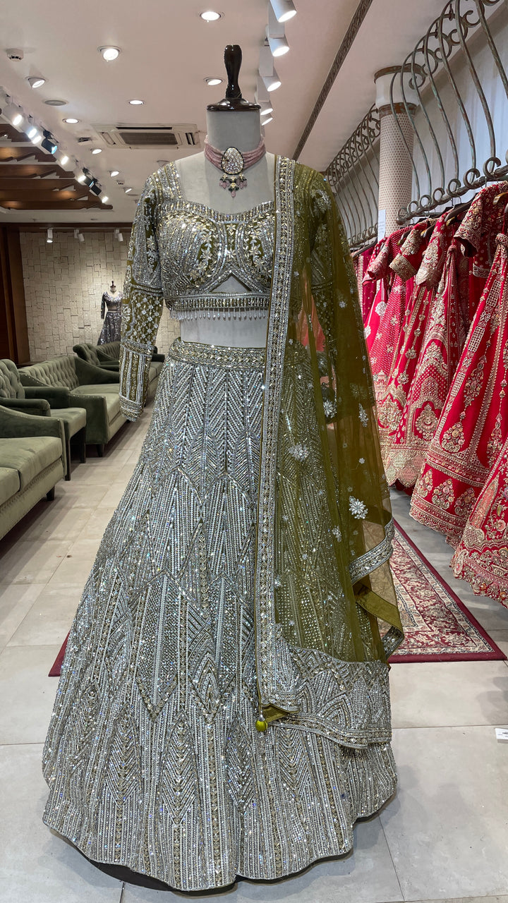 Green net lehenga with sequins embellishments