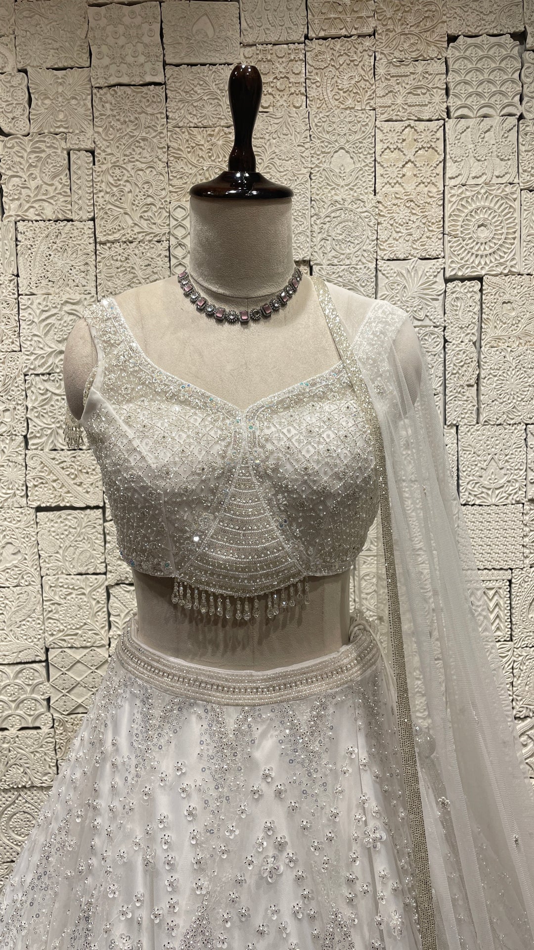 White lehenga with sequins and cutdana embellishments