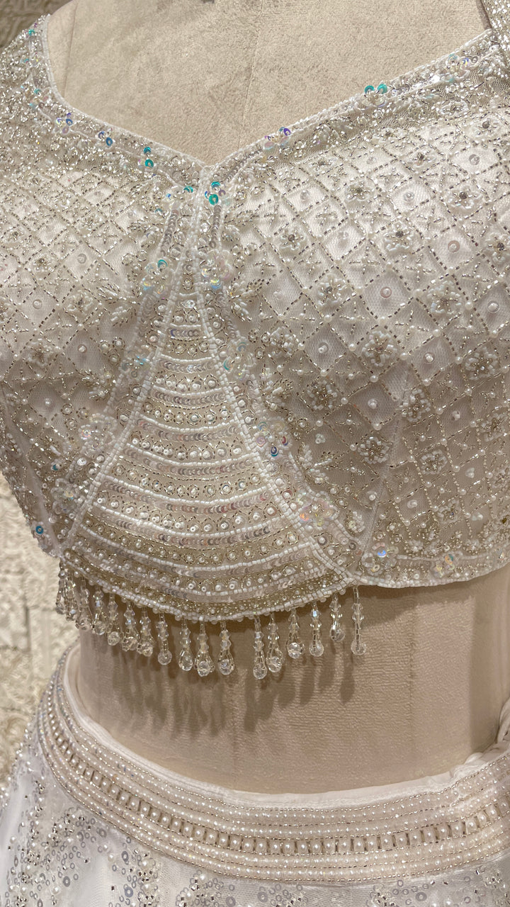 White lehenga with sequins and cutdana embellishments