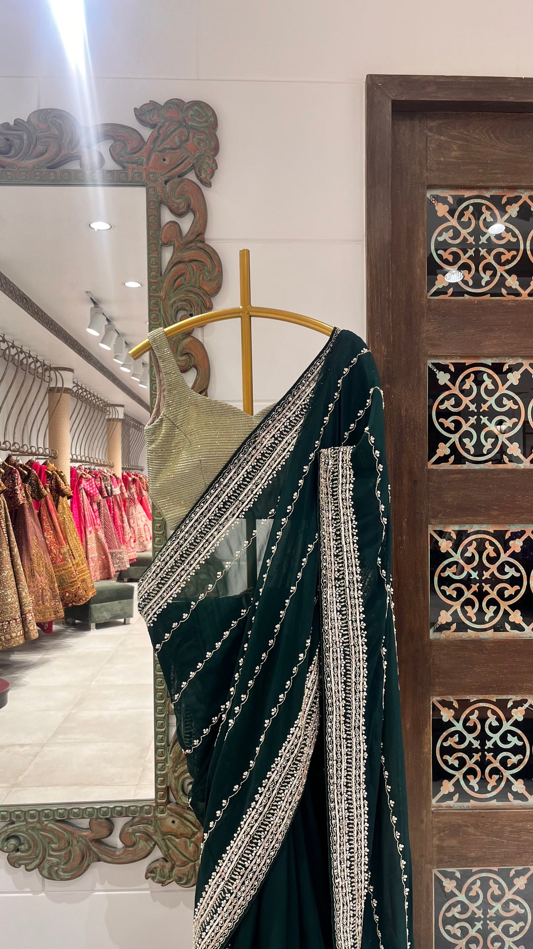 Green saree embellished with complementing gold work