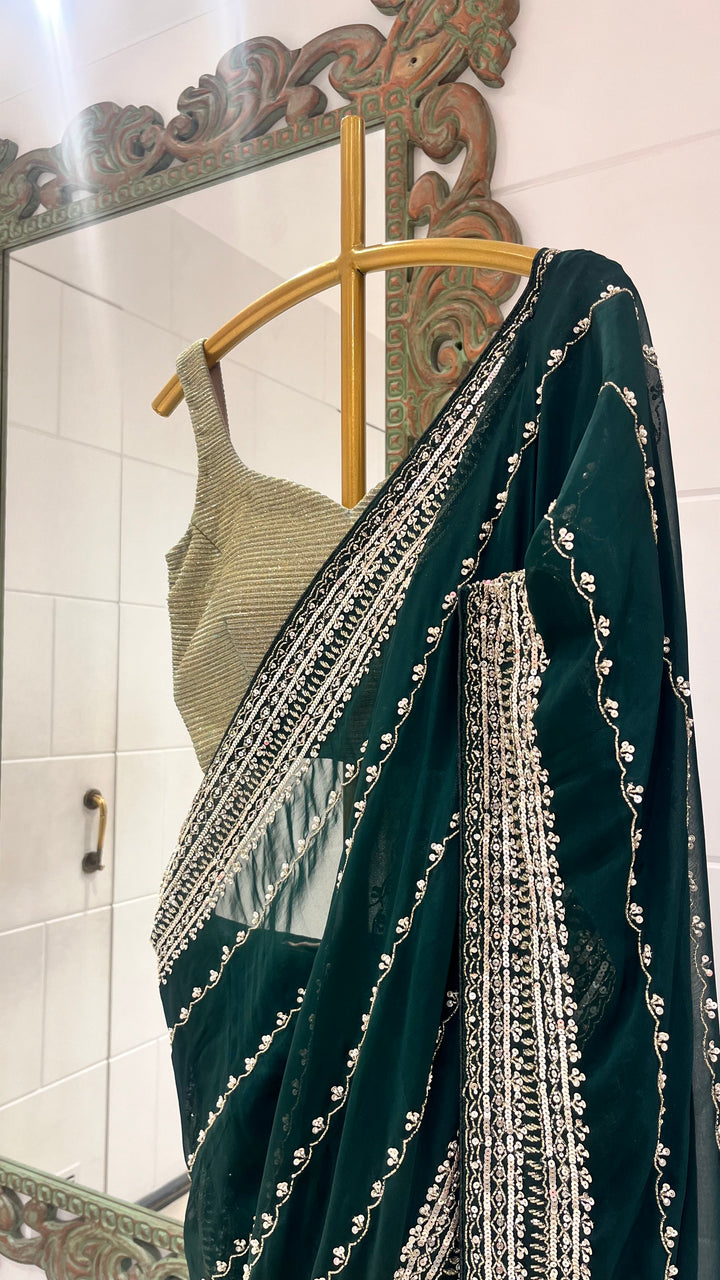 Green saree embellished with complementing gold work