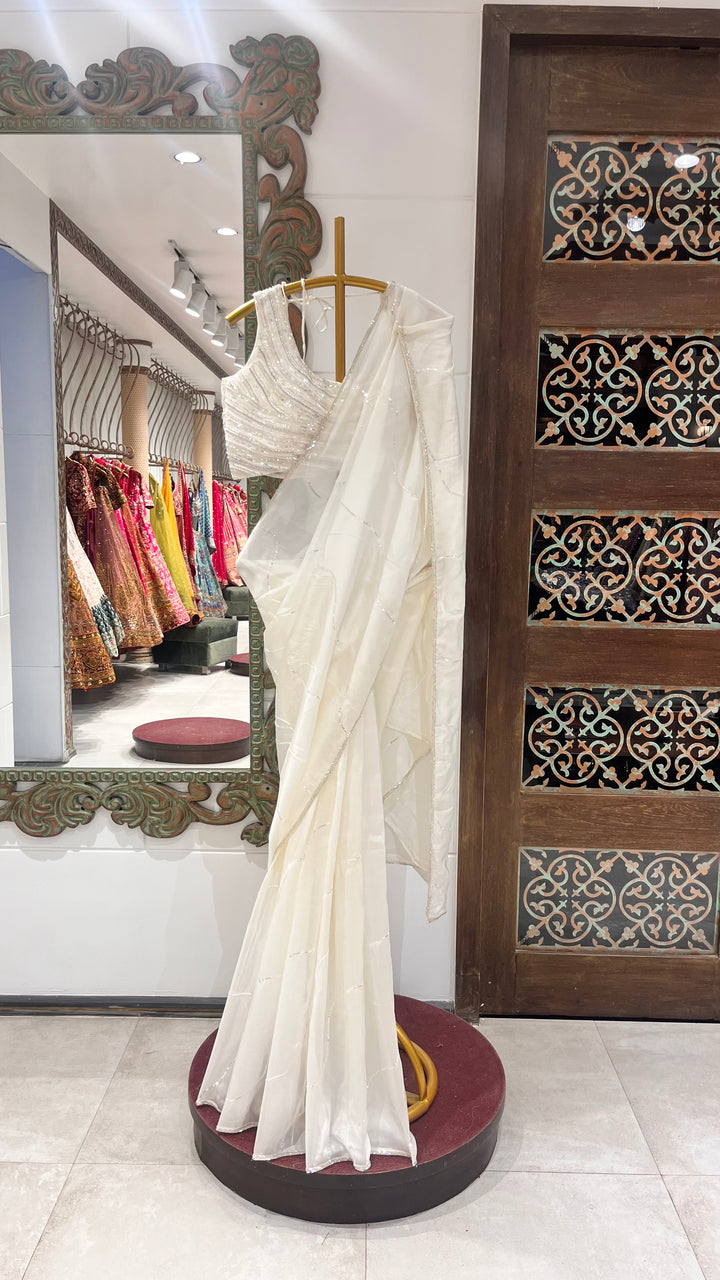 White organza saree embellished with katdana and sequins