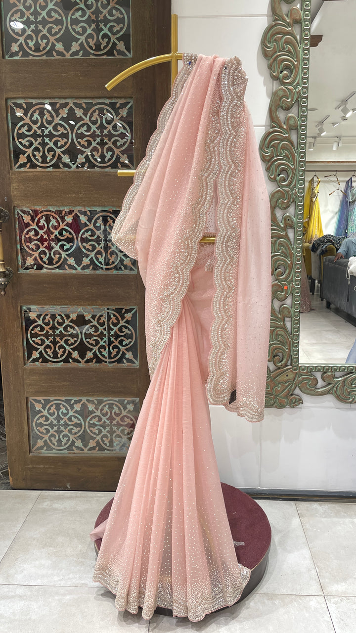 Pastel pink tissue organza saree