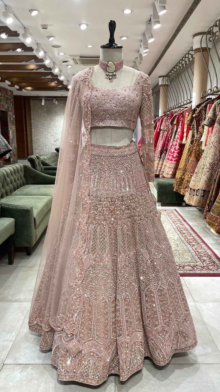 Pastel pink net lehenga with sequins pot and cutdana embroidery