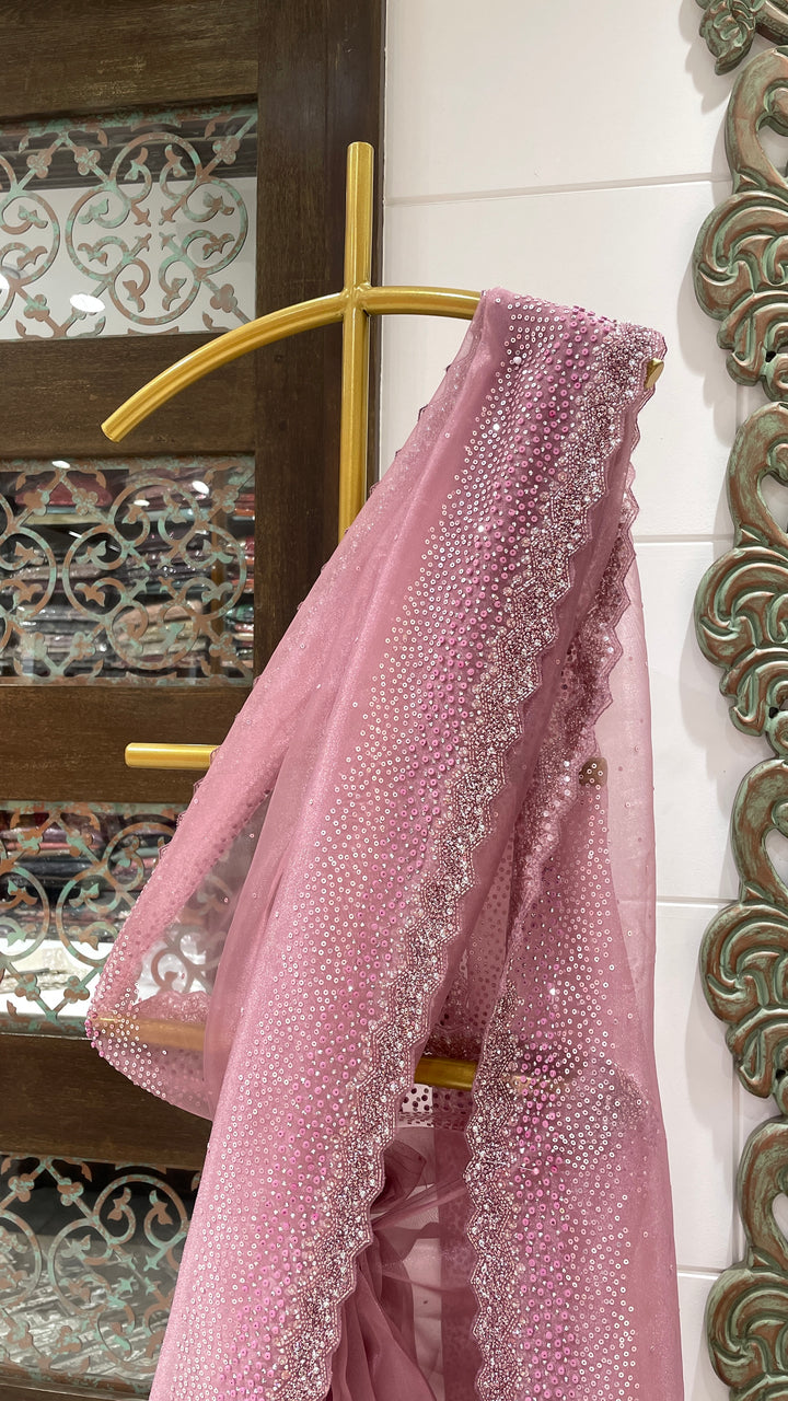 Pink tissue organza saree with sequin and cutdana embellishments