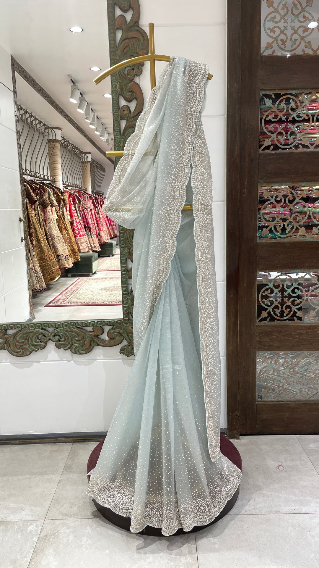 Pastel blue tissue organza saree with scallop border