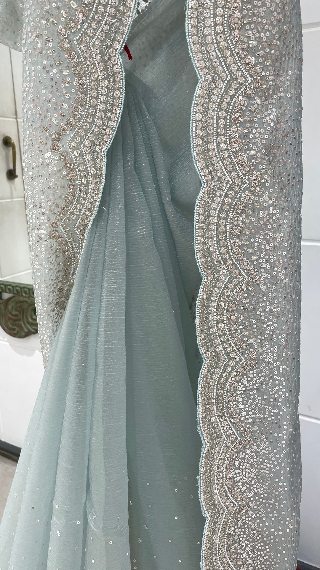 Pastel blue tissue organza saree with scallop border