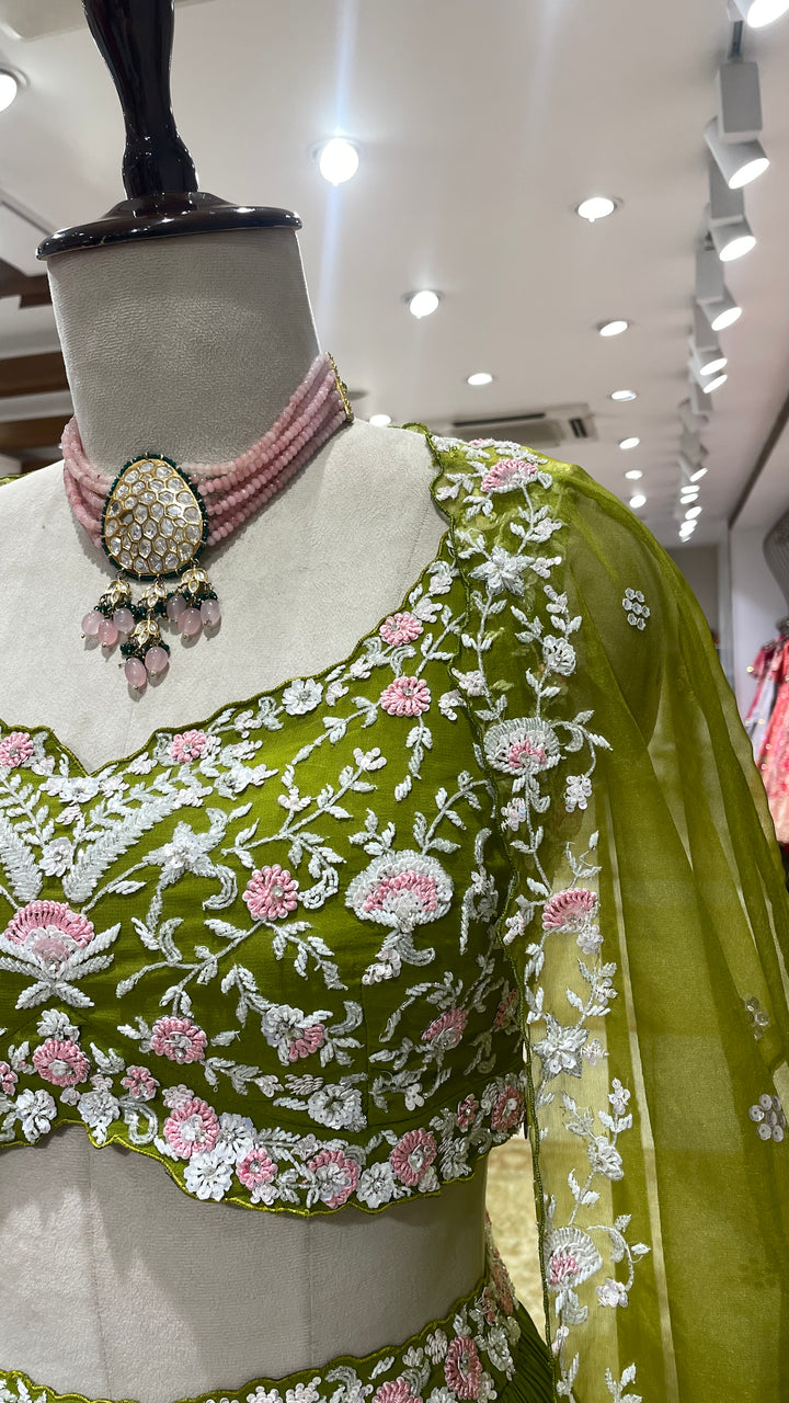 Green cape lehenga with floral motifs