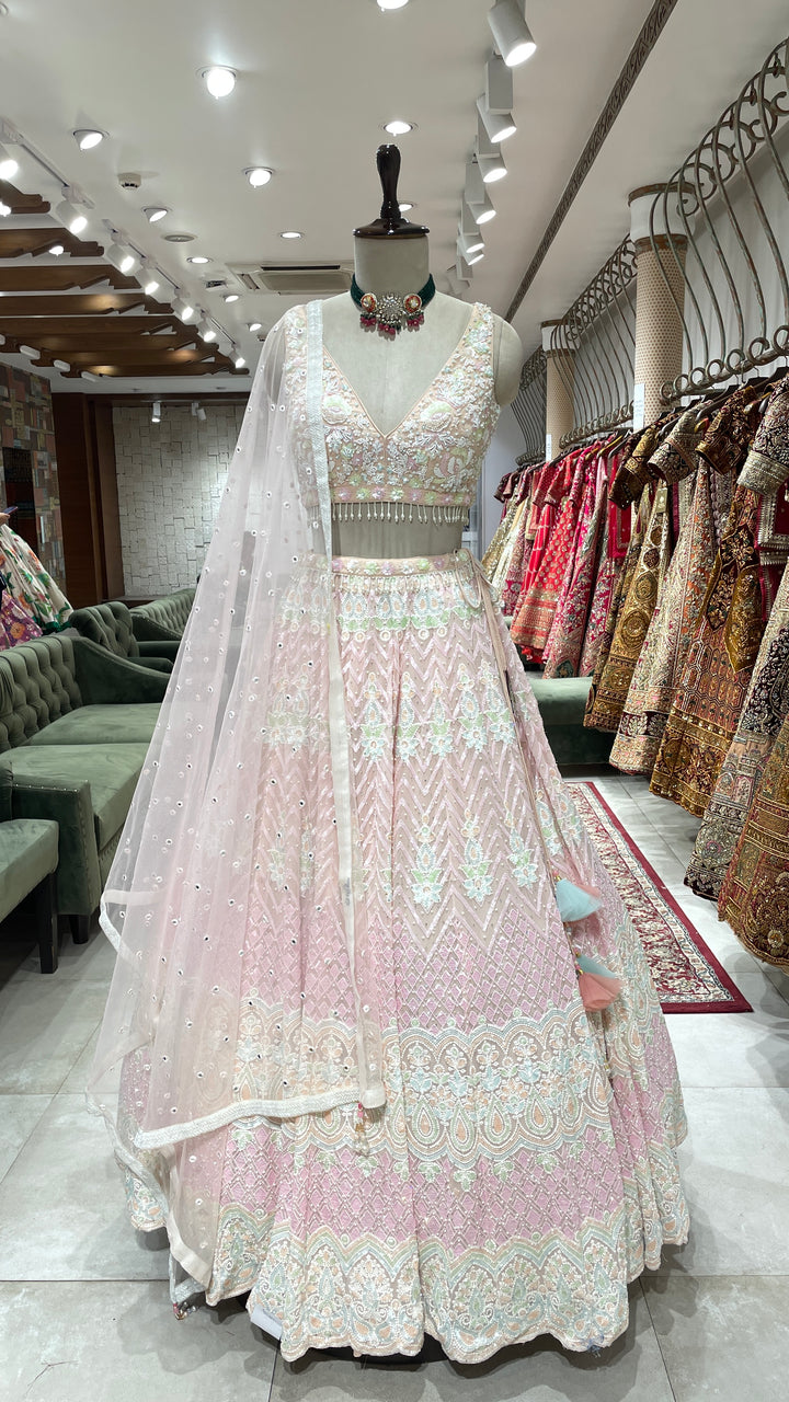 Pastel pink organza lehenga with threadwork and embellishments