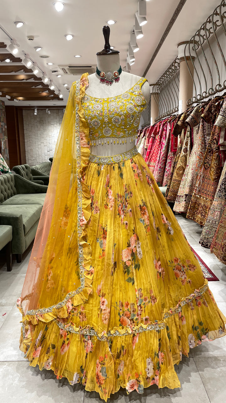 Yellow organza lehenga with floral motifs