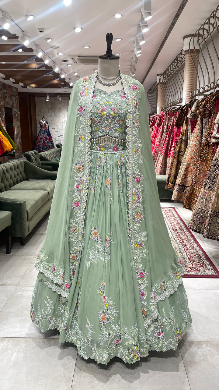 Pastel green Georgette lehenga  with cape and floral motifs