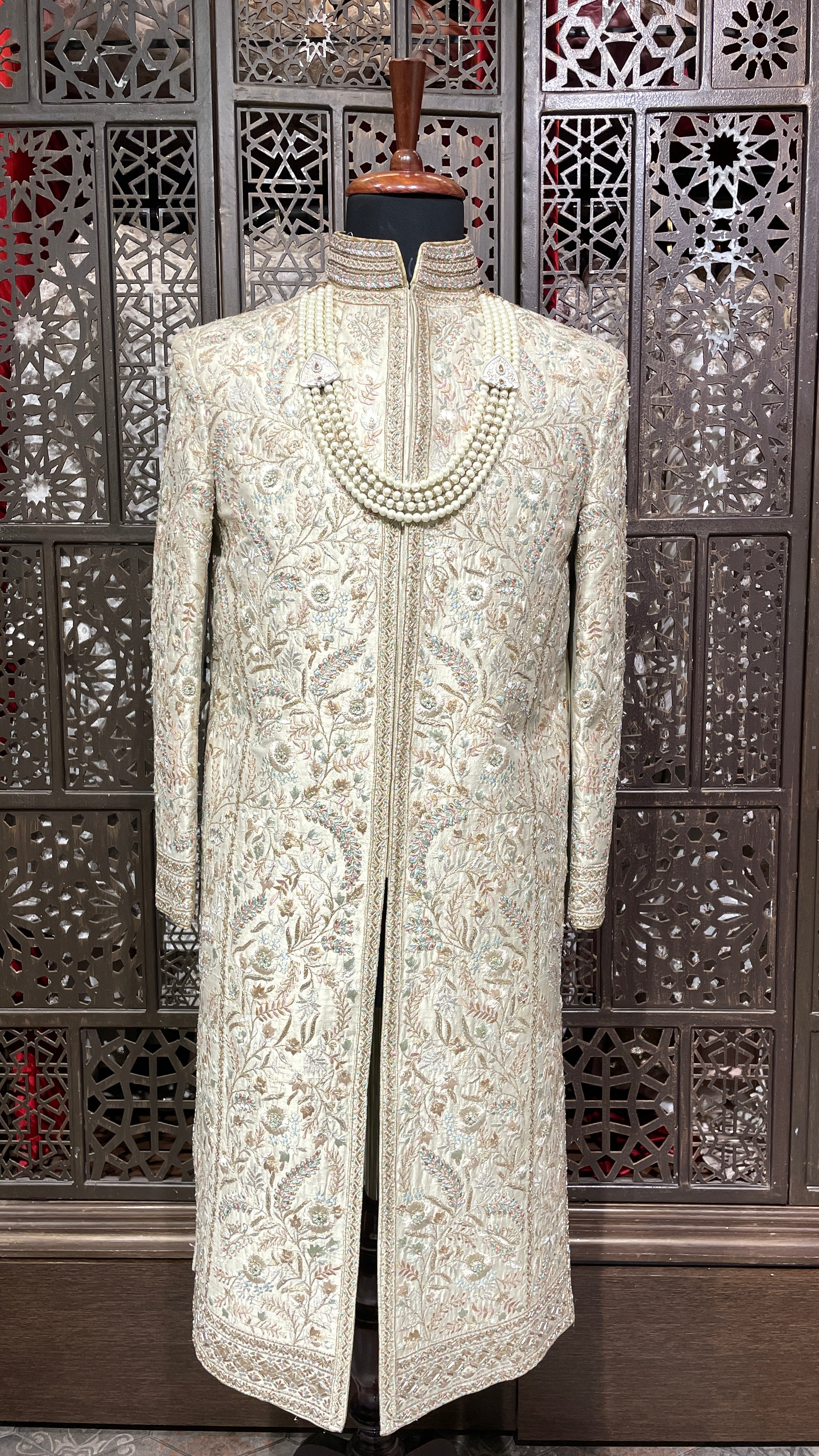 Cream men’s silk sherwani with floral motifs