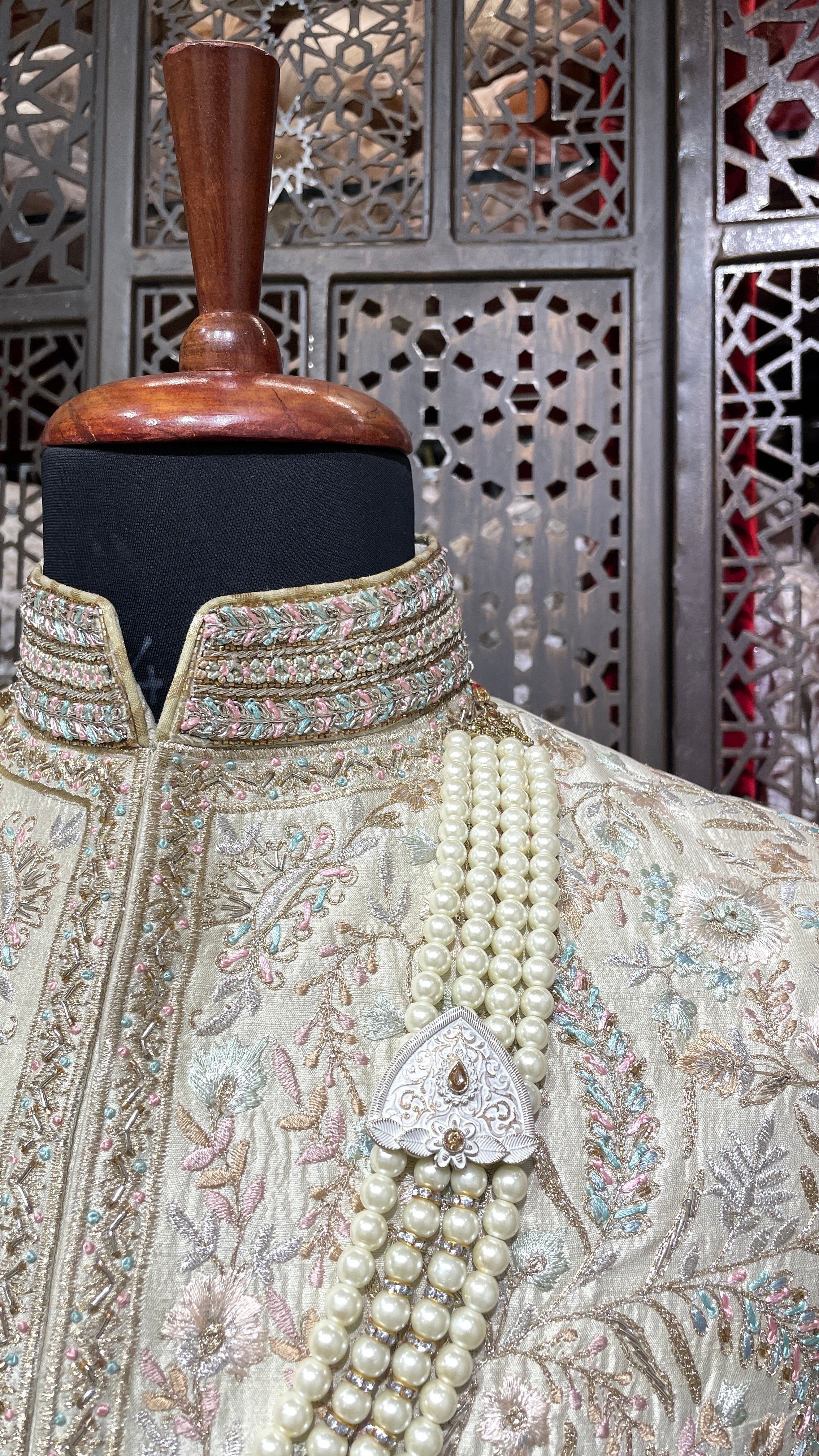 Cream men’s silk sherwani with floral motifs