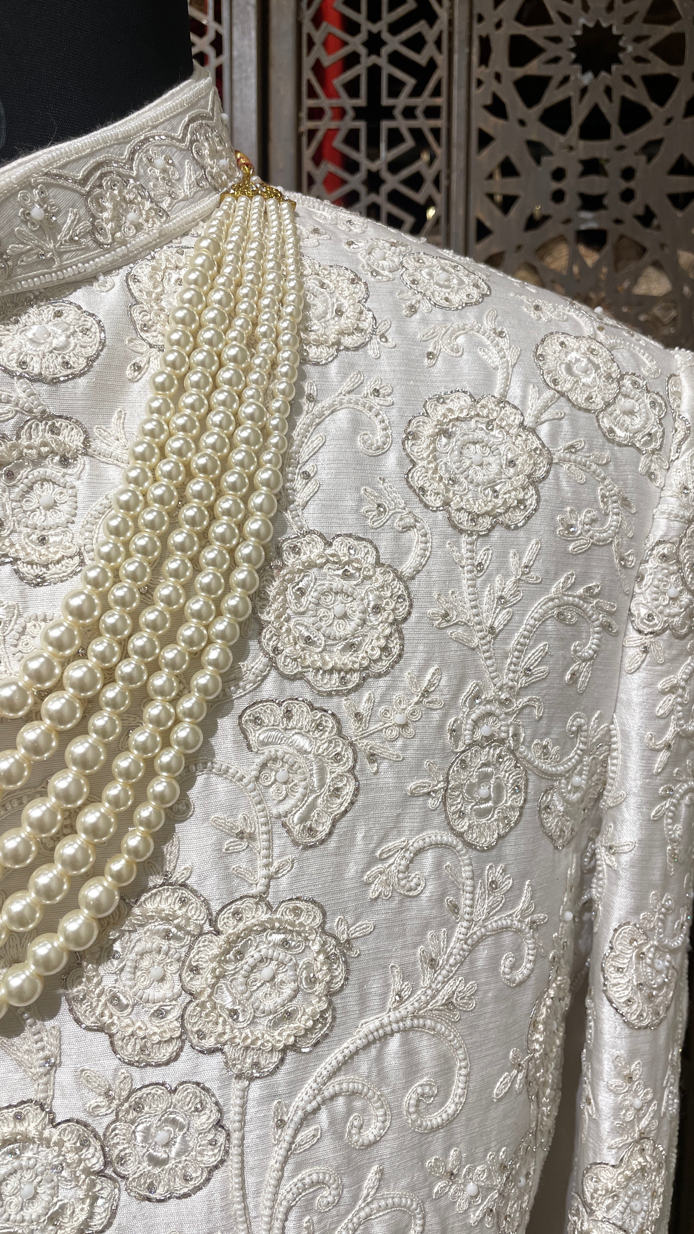 Ivory silk men’s sherwani with pearl and cutdana embellishments
