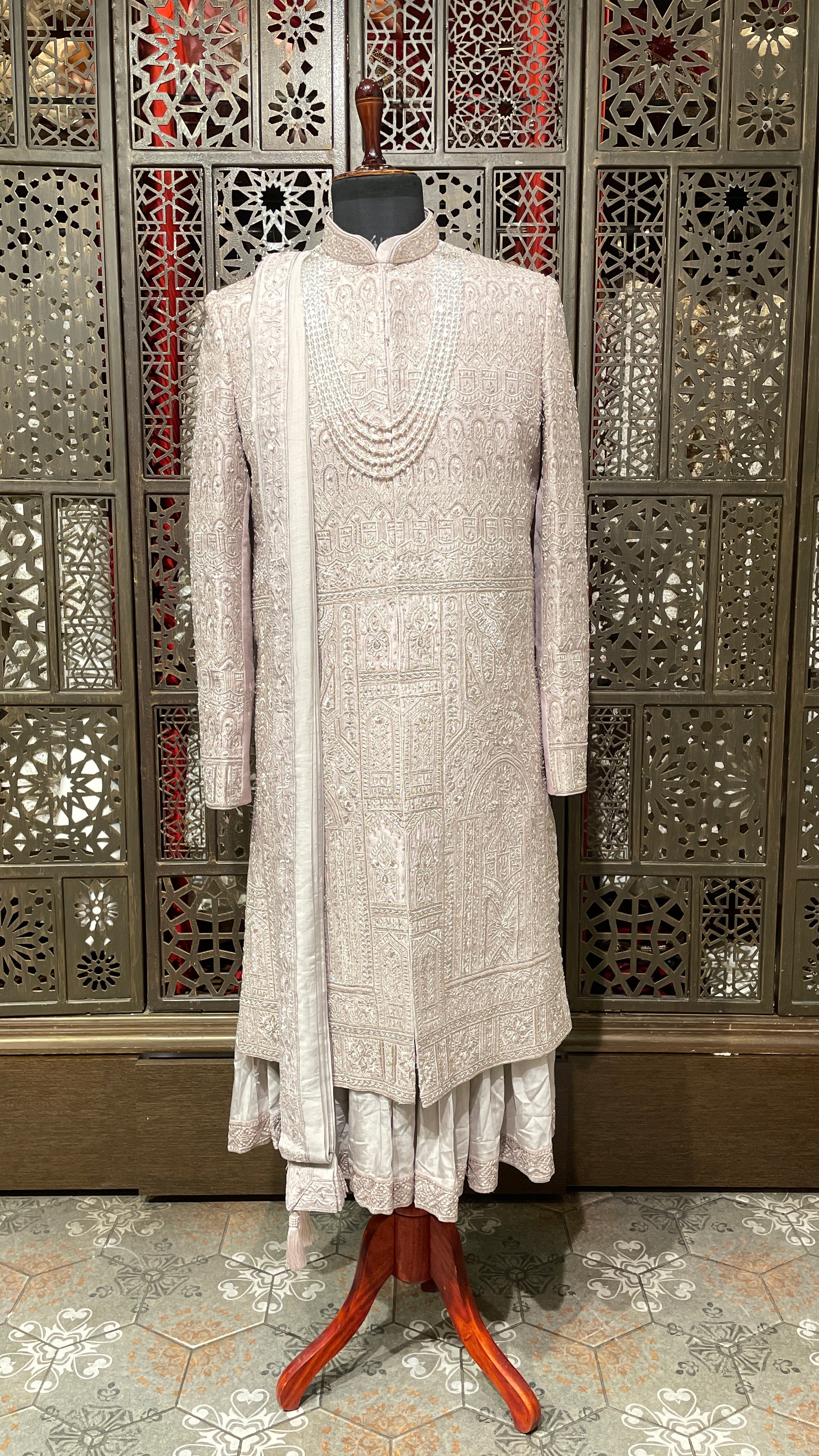 Lilac Anarkali style sherwani with gold embellishment