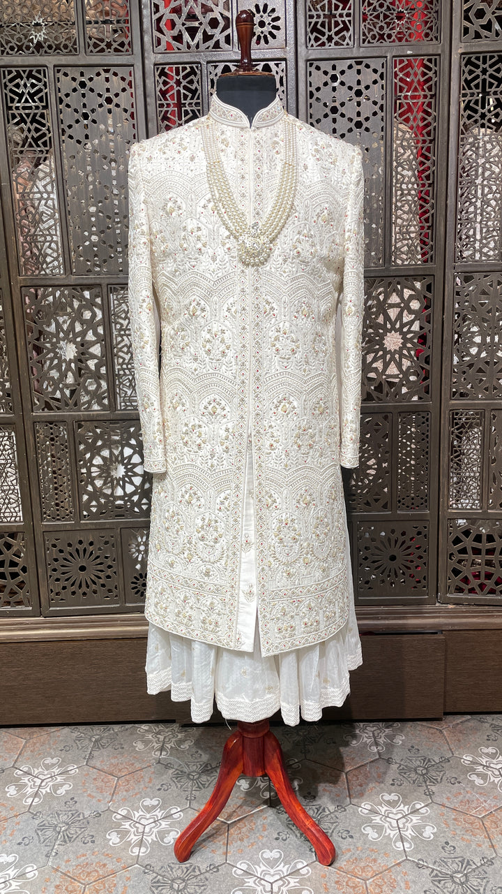 Cream sherwani with Anarkali kurta and zariwork