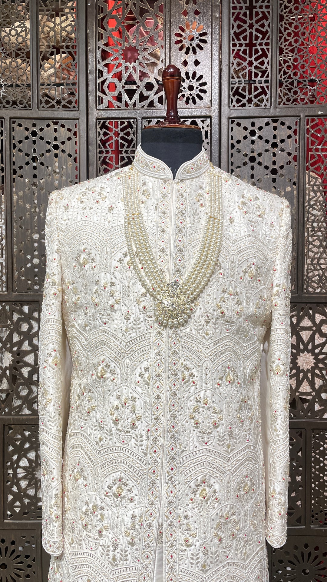 Cream sherwani with Anarkali kurta and zariwork